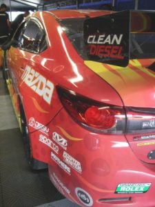 GrandAm's Mazda sports "clean diesel" markings.
