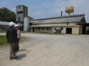 Jill Harris and Robert Kozak discuss 21st century root-and-fruit conversion to building blocks of biofuels and bioproducts by 20th century cannery buildings at KmX research facility in Virginia.