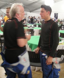 Brad Whitford shares driving experiences with a Jetta TDI Cup competitor after the qualifying session at Petit Le Mans.
