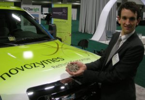 Novozymes Johan Melchior holds the government waste which, via Fiberight's waste-to-fuels process, powered demonstration vehicles at the DC Auto Show